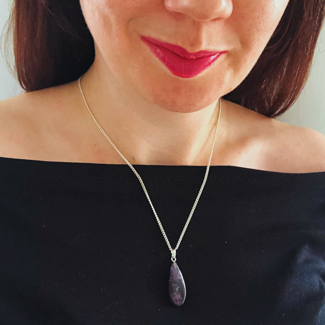 Tiny amethyst worry stone pendant