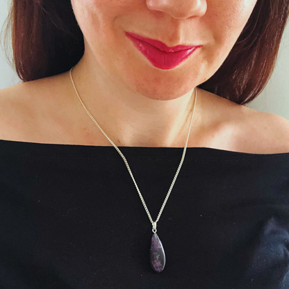 Tiny amethyst worry stone pendant