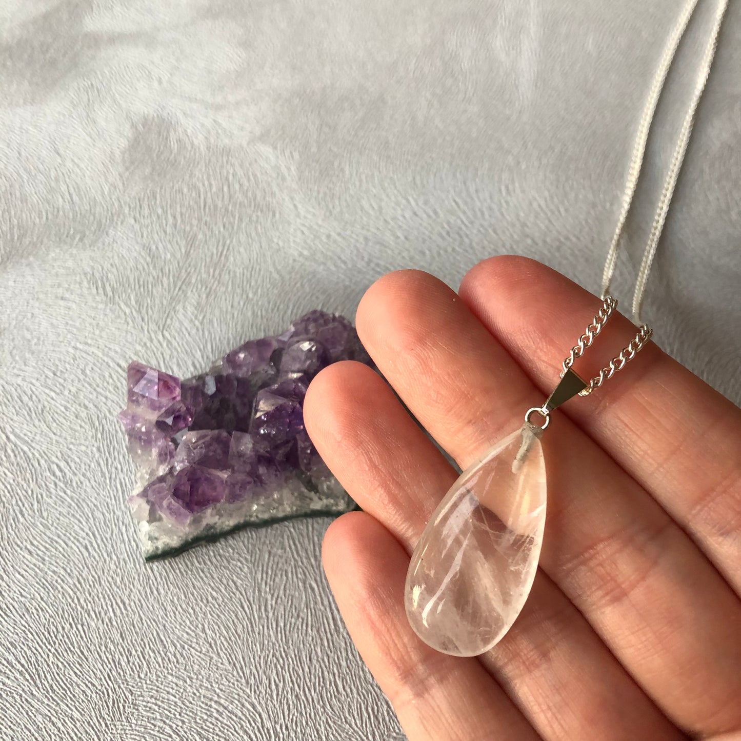 Tiny clear quartz worry stone pendant