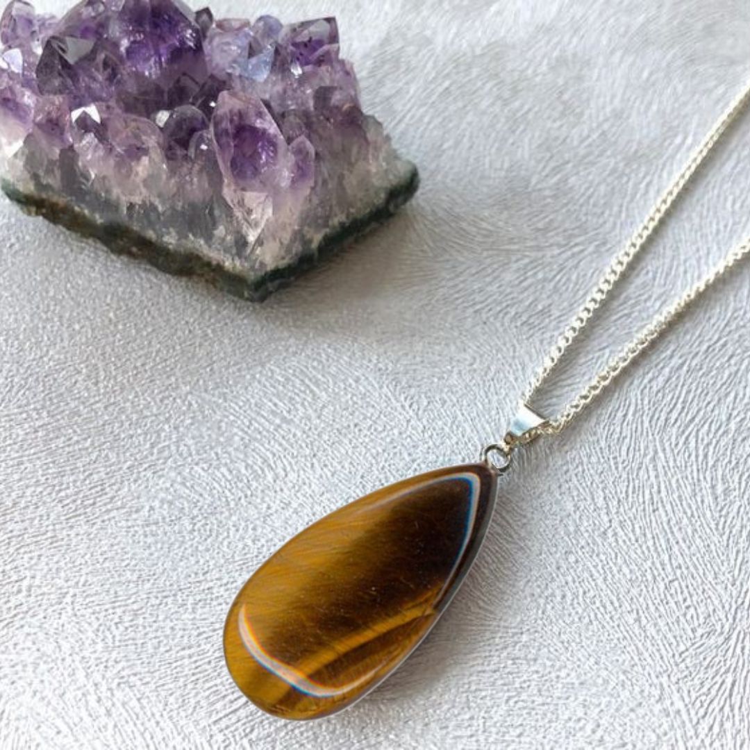 Products Tiny tiger eye worry stone pendant