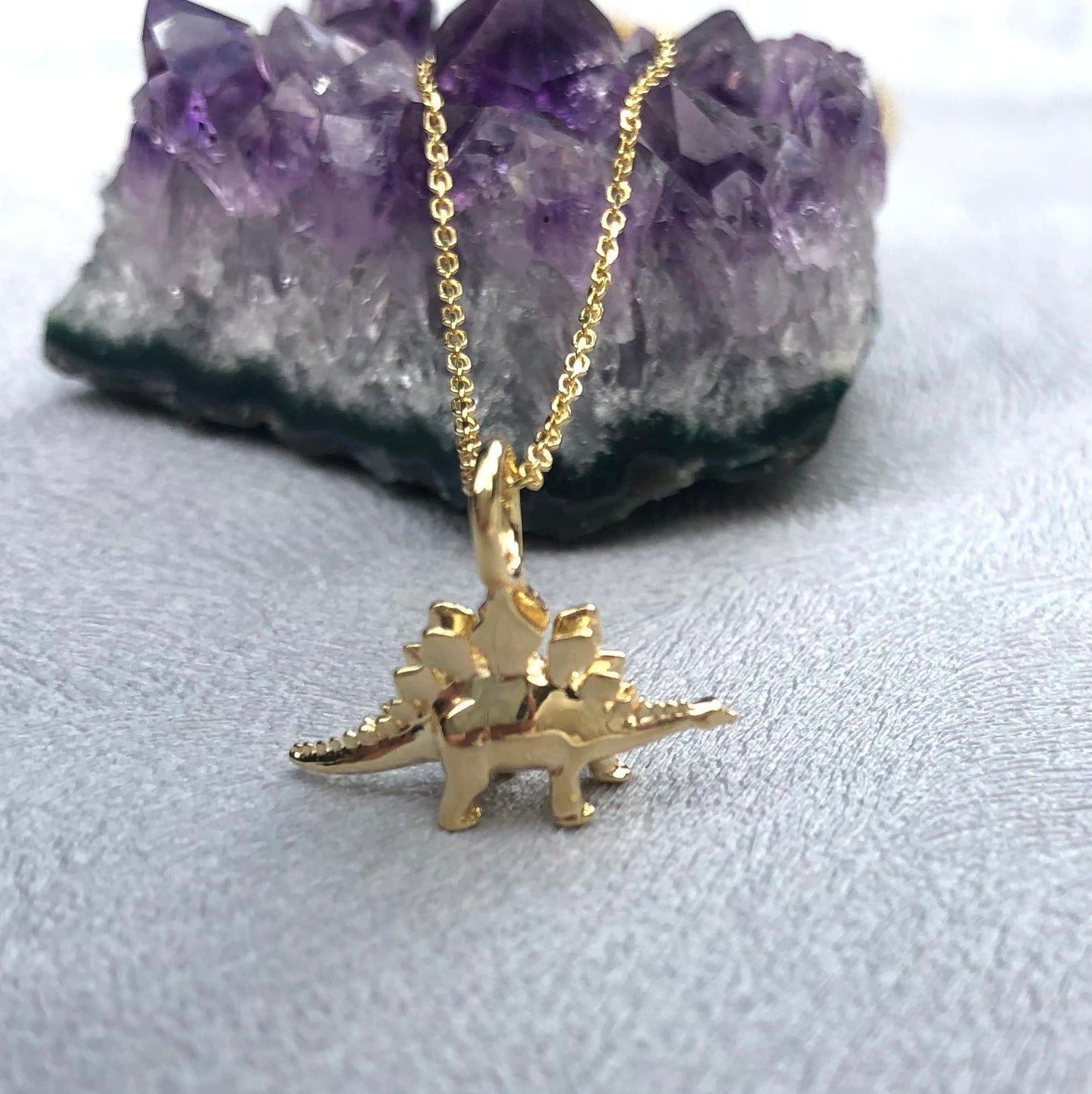 gold dinosaur pendant