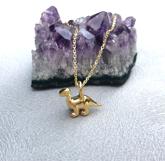 tiny gold dipoducus pendant