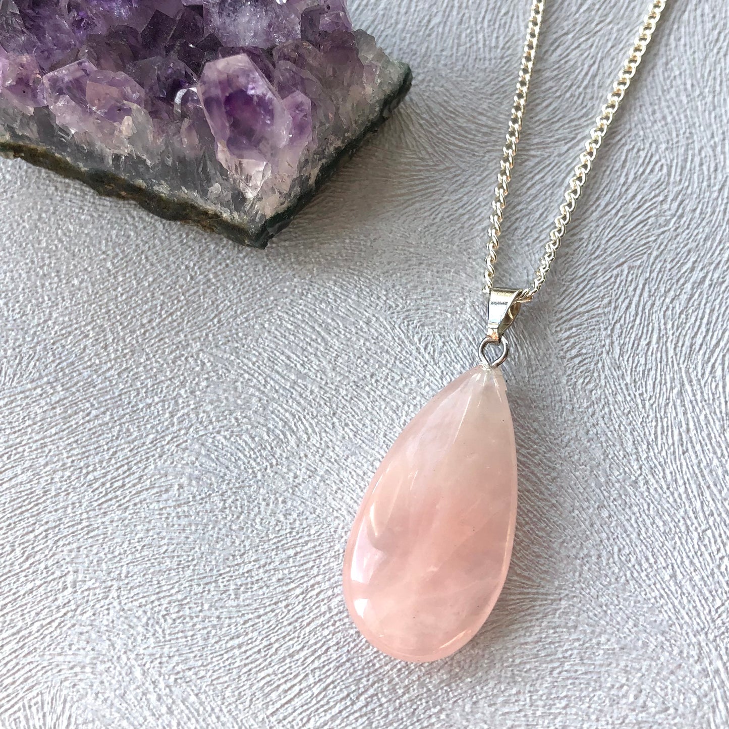 Tiny rose quartz worry stone pendant